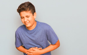 kid in stomach pain